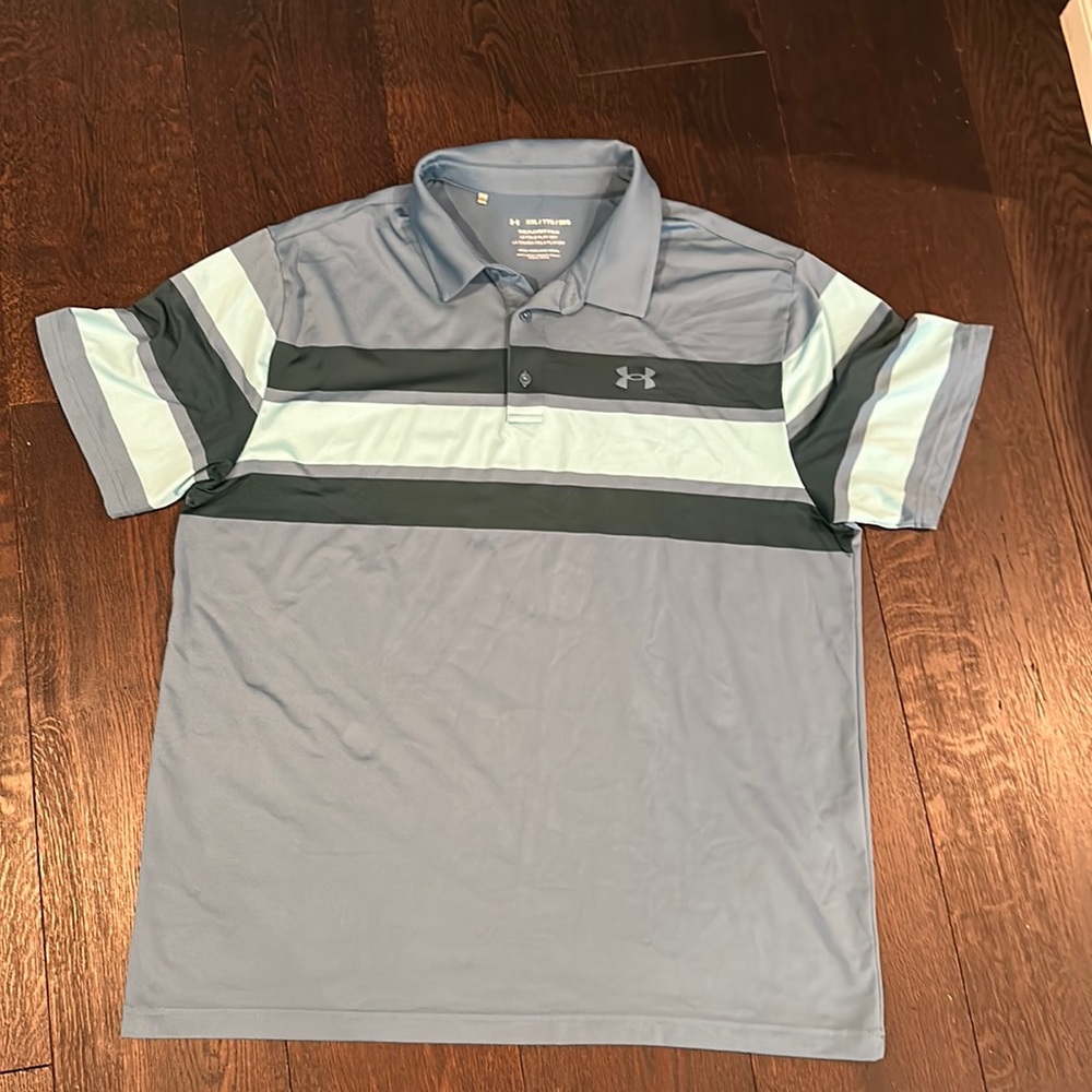 Under armour blue polo with stripes on front and sleeves solid blue back